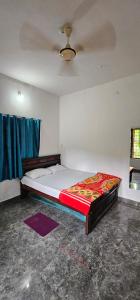 a bedroom with a bed in a room at The Grand White House - Entire Villa in Thekkady