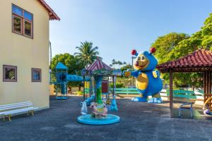 a playground at a park with at Praia Sol Hotel by Castelo Itaipava in Serra