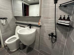 a bathroom with a toilet and a sink at Wizard House in Seoul in Seoul