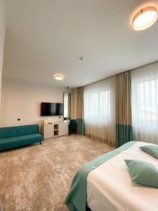 Postel nebo postele na pokoji v ubytování Hotel Coroana
