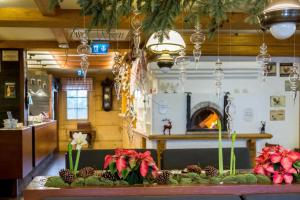 a table with pineapples on it with a fireplace at Chochołowy Dwór in Jerzmanowice