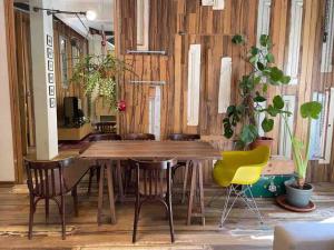 a wooden table and chairs in a room at Designer 1BR apt in Gemmayze in Beirut