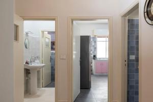 a bathroom with a sink and a mirror at Mauds Elegant Cocoon at Monot in Beirut +21 photos