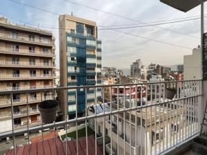 a view of a city from a balcony with buildings at Artist Nest In Getaoui, Achrafieh in Beirut
