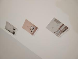 a group of three small buildings in a white wall at منزل سيد سعد in Cairo