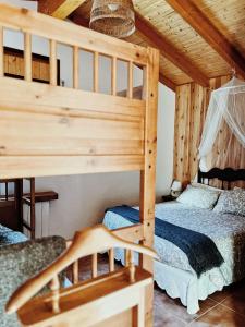 a bedroom with two bunk beds in a cabin at Apartaments Cel i Fusta in Camprodon +76 photos
