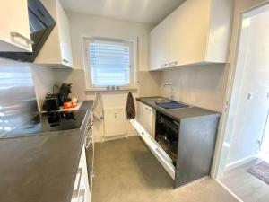 a kitchen with a sink and a stove top oven at Apartment- Metzingen in Metzingen