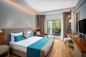 Postel nebo postele na pokoji v ubytování Side Story Resort & Spa + 34 fotografií