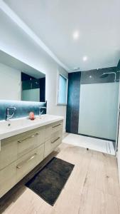 a bathroom with a sink and a shower at Pen ar Creac'h in Crozon +14 photos