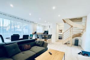 a living room with a couch and a table at Pen ar Creac'h in Crozon