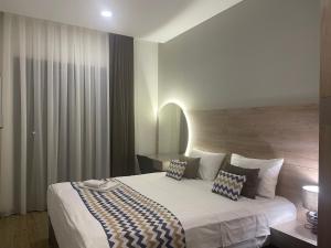 Postel nebo postele na pokoji v ubytování 4Guest Hotel