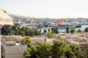 a view of a harbor with boats in the water at Elegant apartment with breathtaking cityscape view (Drap_F5) in Piraeus