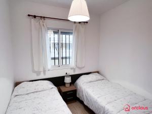 Postel nebo postele na pokoji v ubytování El Oasis