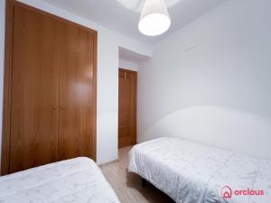 Postel nebo postele na pokoji v ubytování El Oasis