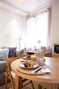 a living room with a table with a plate of food on it at Agave Marina in Marciana Marina