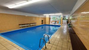 a large swimming pool in a hotel room at Ferienwohnung Ünal in Prien am Chiemsee