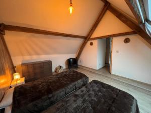 Postel nebo postele na pokoji v ubytování Gîte Rubis - JACUZZI - Pairi Daiza - 6 pers