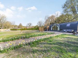 a garden with flowers in front of a building at 1 Bed in Shotley Bridge 87934 in Shotley Bridge