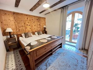 a bedroom with a bed and a large window at Villa Evy in Mutters