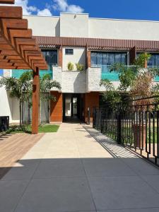 a building with a fence in front of it at Pousada Villas - Bonito in Bonito