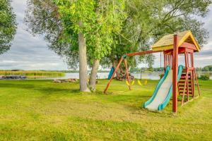 a playground with a slide in a park at Lakeside Living - BBQ Fun, Boat Deck and Playground in Lakefield