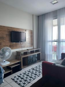 Et tv og/eller underholdning på Frente Mar Green Diamond Residencial