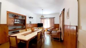 a living room with a dining room table and chairs at Casa Gloria y Vicente in Potrerillos