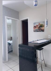 a black counter in a room with a bedroom at Frente Mar Green Diamond Residencial in Vila Velha +68 photos