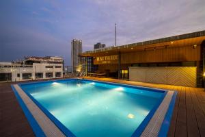 a large swimming pool on the roof of a building at Hai Trieu Hotel in Danang