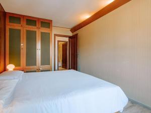 Posteľ alebo postele v izbe v ubytovaní Apartment Condominio al Parco-9 by Interhome