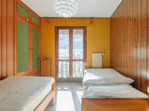 Posteľ alebo postele v izbe v ubytovaní Apartment Condominio al Parco-9 by Interhome