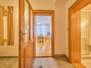 a hallway with a door leading to a dining room at Apartment Stříbrný pramen-1 by Interhome in Janske Lazne