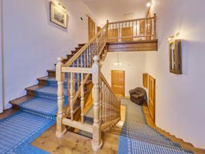 a spiral staircase in a home with wooden floors at Apartment Stříbrný pramen-1 by Interhome in Janske Lazne +27 photos