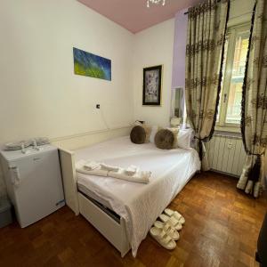 Postel nebo postele na pokoji v ubytování Fenice
