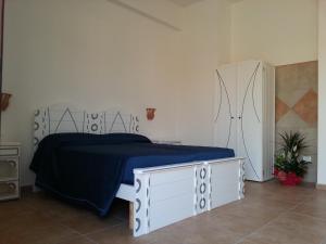 A bed or beds in a room at Agriturismo Tenuta Don Giovanni