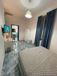 Posteľ alebo postele v izbe v ubytovaní Dante Rooms