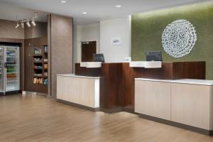 a lobby of a store with a reception desk at Fairfield Inn & Suites by Marriott Ithaca in Ithaca