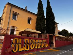 a building with graffiti on the side of a street at Hostel Old School in Rijeka