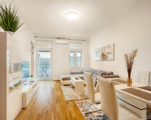 a living room with a couch and a table at Flarent Vienna Apartments-HG in Vienna