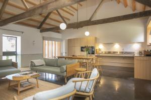 a living room with a table and a kitchen at Lookout in Dorchester