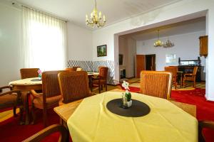 a dining room with a table and chairs at Haus am Walde in Bad Fallingbostel