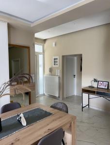 a living room with a table and a piano at Silver House in Asímion