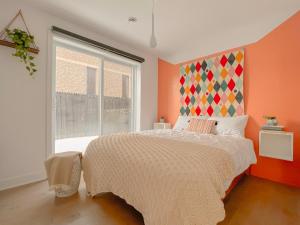 a bedroom with a large bed and a window at Mila Suites in Montreal