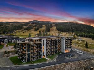 an aerial view of a building with a parking lot at New Nice apartment Trysil alpine lodge with the lift right outside in Trysil