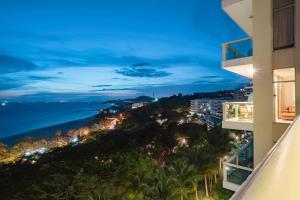 a view of the ocean at night from a building at Casa Home - Ocean Melody - Beach Front 3br Apartment in Phan Thiet