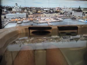 a view of a city with boats in the water at Private apartment suite with sauna themed bedroom, private jacuzzi, city center by train 15min in Helsinki
