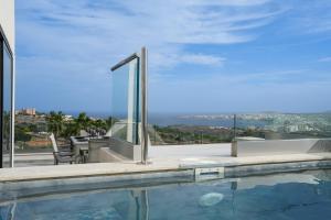 a house with a swimming pool with a view at Lux Sea&Country Views with Pool in Mellieħa