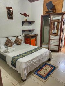 Postel nebo postele na pokoji v ubytování Pousada D'Pillel + 78 fotografií