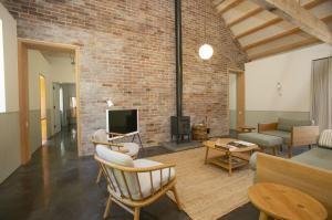 a living room with a brick wall at Lookout in Dorchester