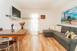 a living room with a couch and a table at Blue Ski 6 by Homestaygrancanaria in San Bartolomé de Tirajana